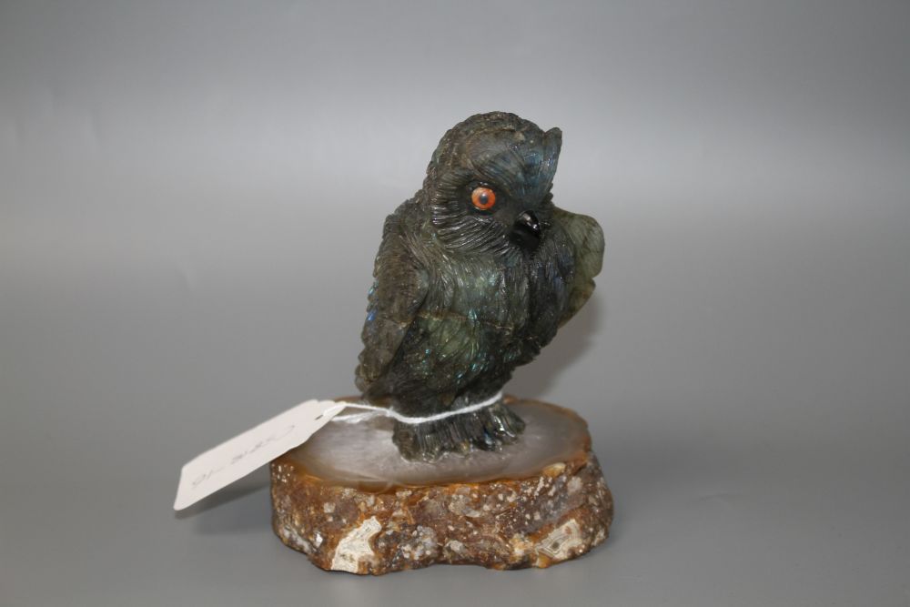 A carved labradorite model of an owl on an agate base, height 12.8cm.